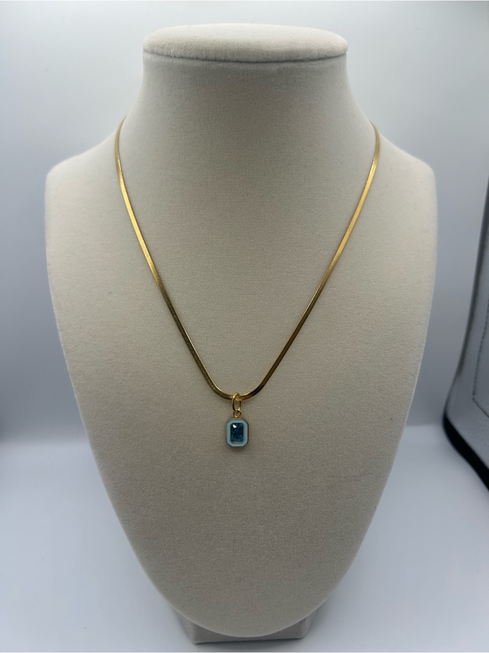 Gold tone Herringbone Necklace with Blue stone enamel Pendant